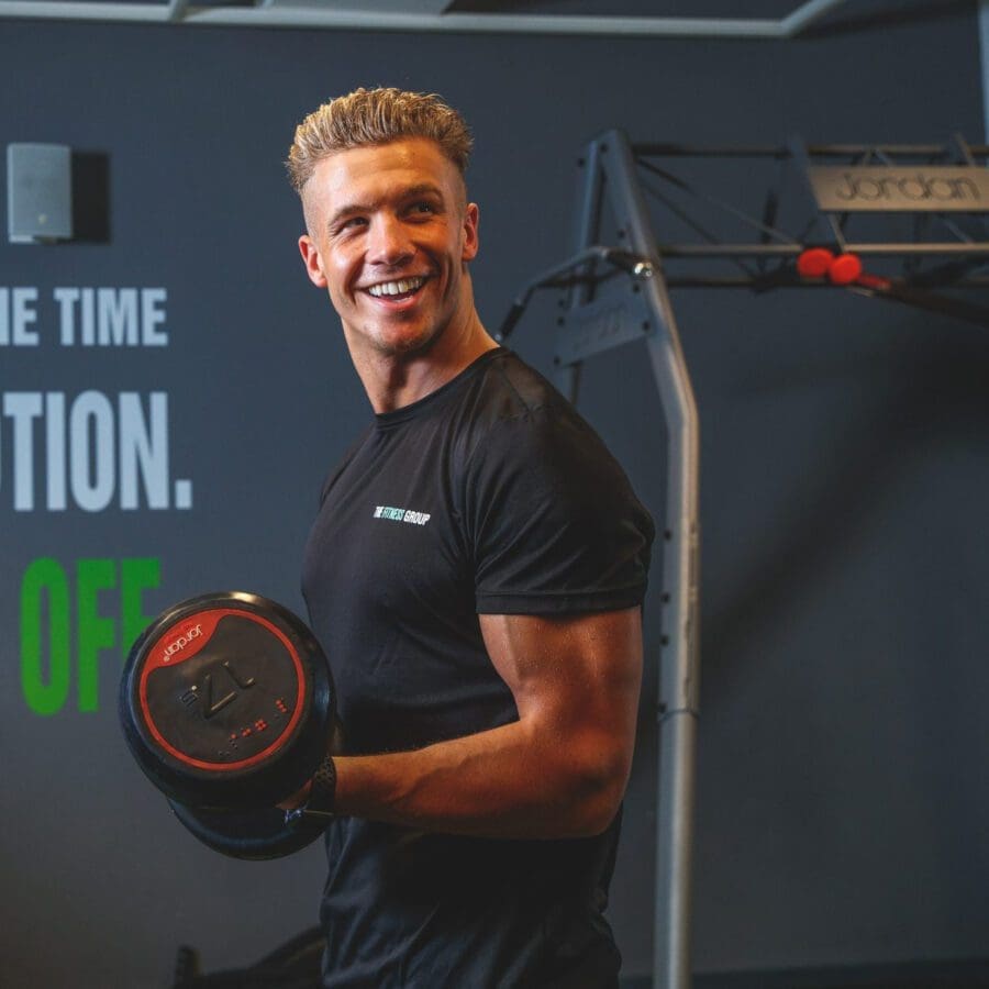 gym jobs fitness instructor curling barbell